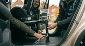 Photorealistic demonstration of a correctly installed 360 rotating base, with the support leg adjusted to the footwell of a modern UK car.