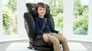 A photorealistic 4K studio photograph showcasing the car seat reconfigured into a high-back booster with the harness removed and a vehicle 3-point seat belt correctly routed through the belt guide.