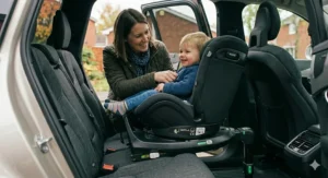 Photorealistic view of the rotation mechanism on a 360 car seat base, demonstrating how the seat clicks into place for side-access boarding.