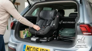 A compact Maxi-Cosi car seat and folded chassis stored neatly inside the boot of a standard UK family car.