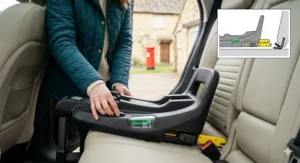 Infographic detailing Nuna car seat compliance with R129 i-Size safety standards. Schematic green light overlays indicate reinforced zones, energy-absorbing foam layers, and integrated Side Impact Protection within the specific seat model.