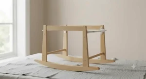 Close-up of a natural pine rocking stand for a Moses basket.