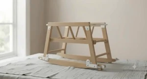 Elegant white-painted rocking stand for a Moses basket.