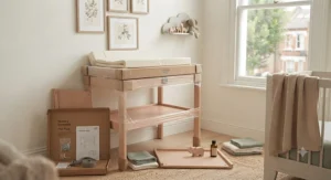 Flat-pack packaging next to an assembled changing table under £50 ready for DIY nursery setup.