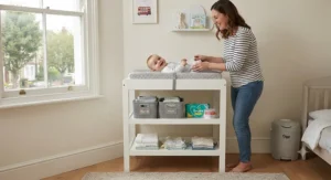 A modern, budget-friendly nursery featuring a white wooden changing table under £50 decorated with storage baskets.