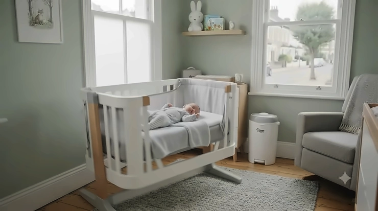 A stylish, modern wooden swing crib in a contemporary British nursery. best swing crib