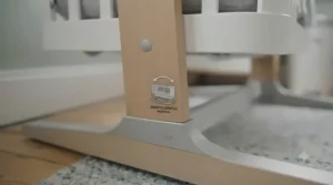 A stable, high-quality base frame supporting a baby swing crib.