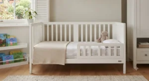 Convertible cot bed shown in toddler bed stage.