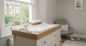 White nursery changing unit with spacious drawers for baby clothes, ideal for compact British homes.