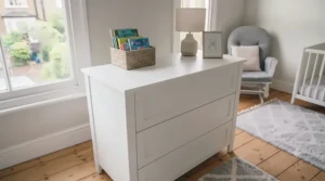 Convertible chest of drawers with the removable changing top taken off, used as a standard child's bedroom storage unit.