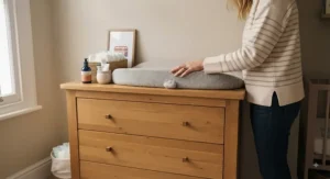 Ergonomically designed wooden changing dresser at a comfortable standing height for parents.