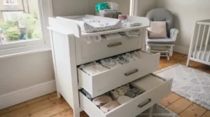 Deep nursery storage drawers in a combination changer unit compared to open shelving on a standalone changing table.