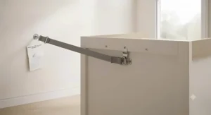 Safety wall strap attached to a secure changing table dresser combo meeting UK nursery standards.