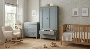 Coordinated nursery furniture collection showing a wardrobe with drawers alongside a matching cot bed and chest of drawers.