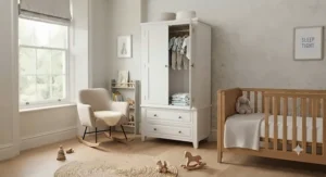 Classic panelled white wardrobe featuring lower drawers, designed with traditional British nursery aesthetics in mind.